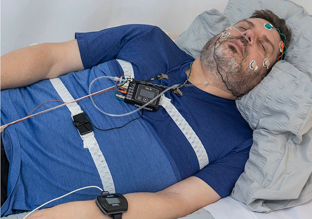 Man sleeping during sleep study